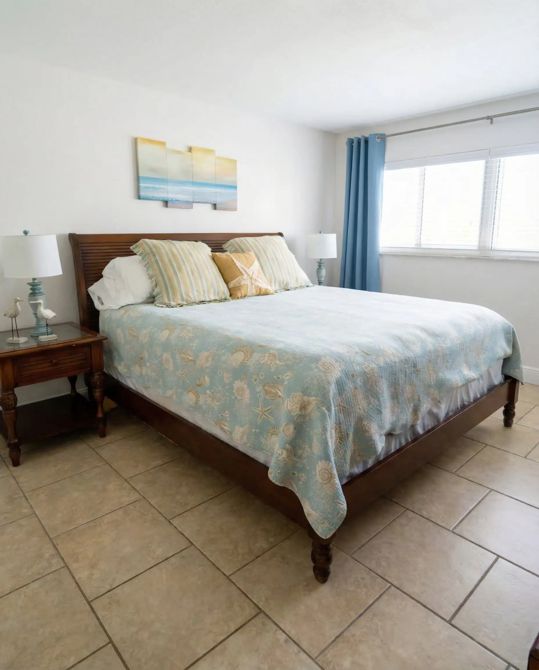 Welcoming coastal vacation rental bedroom with crisp linens and a clean, comfortable layout