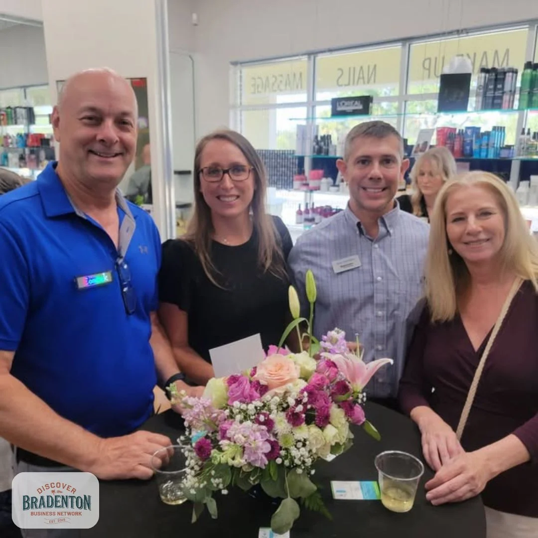4 people standing at table bradenton
