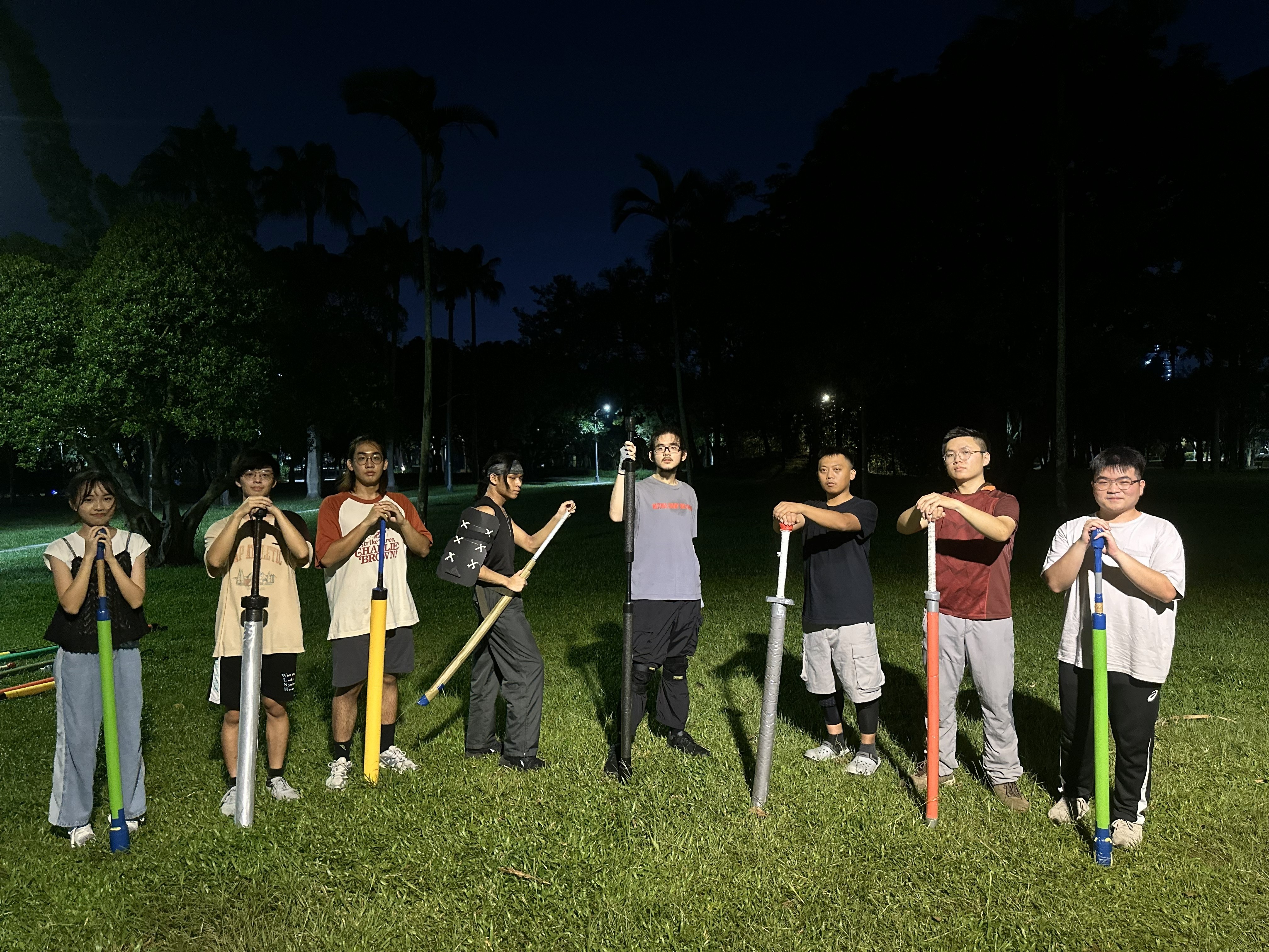 woman holding a phone and man looking at the phone. both are smiling