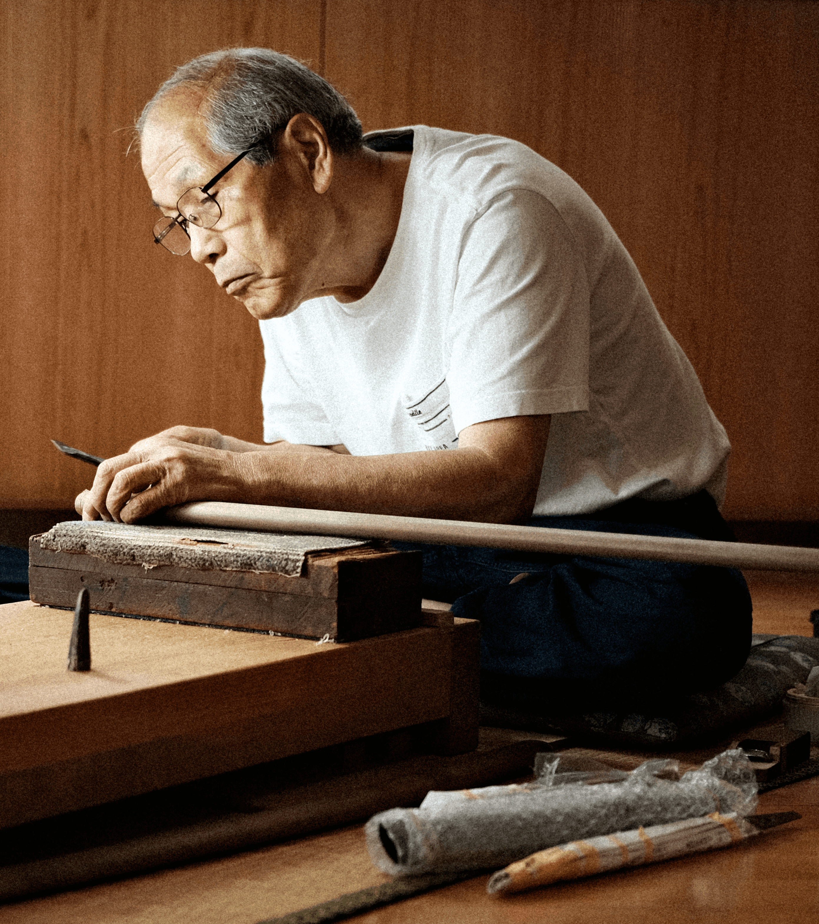 Swordsmiths hammering iron in a team
