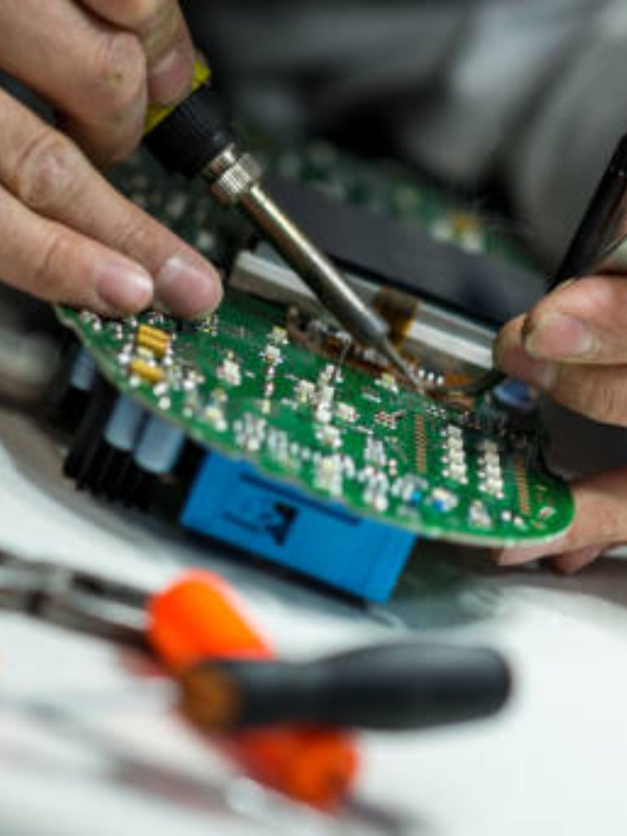 a yellow robot sitting on top of a table