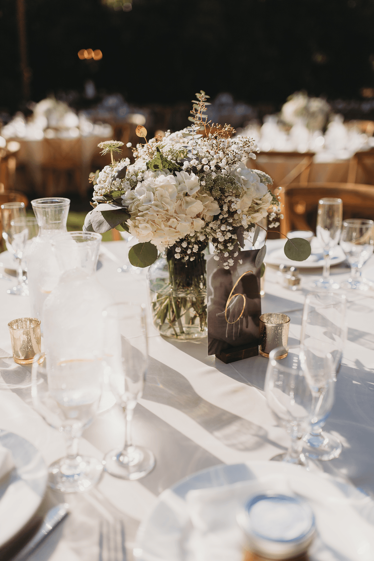 Flat lay wedding details with bouquet, rings, and sparkling bridal heels