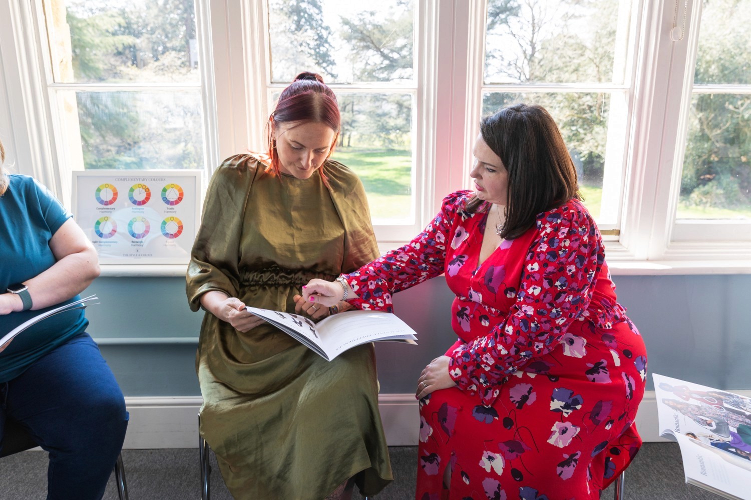 Lucy assisting a lady with colour theory