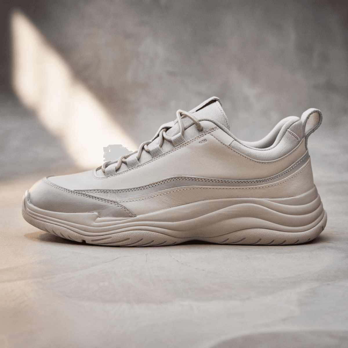 Beige Urban Drift men's sneaker from Corbell with textured sole and sleek layered design.
