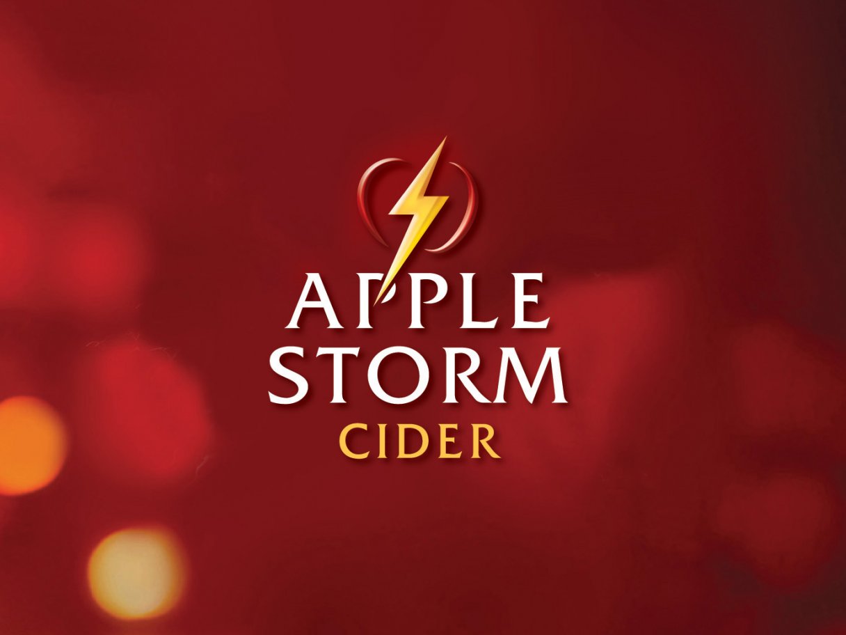 Rustic cabin in a golden field at sunset