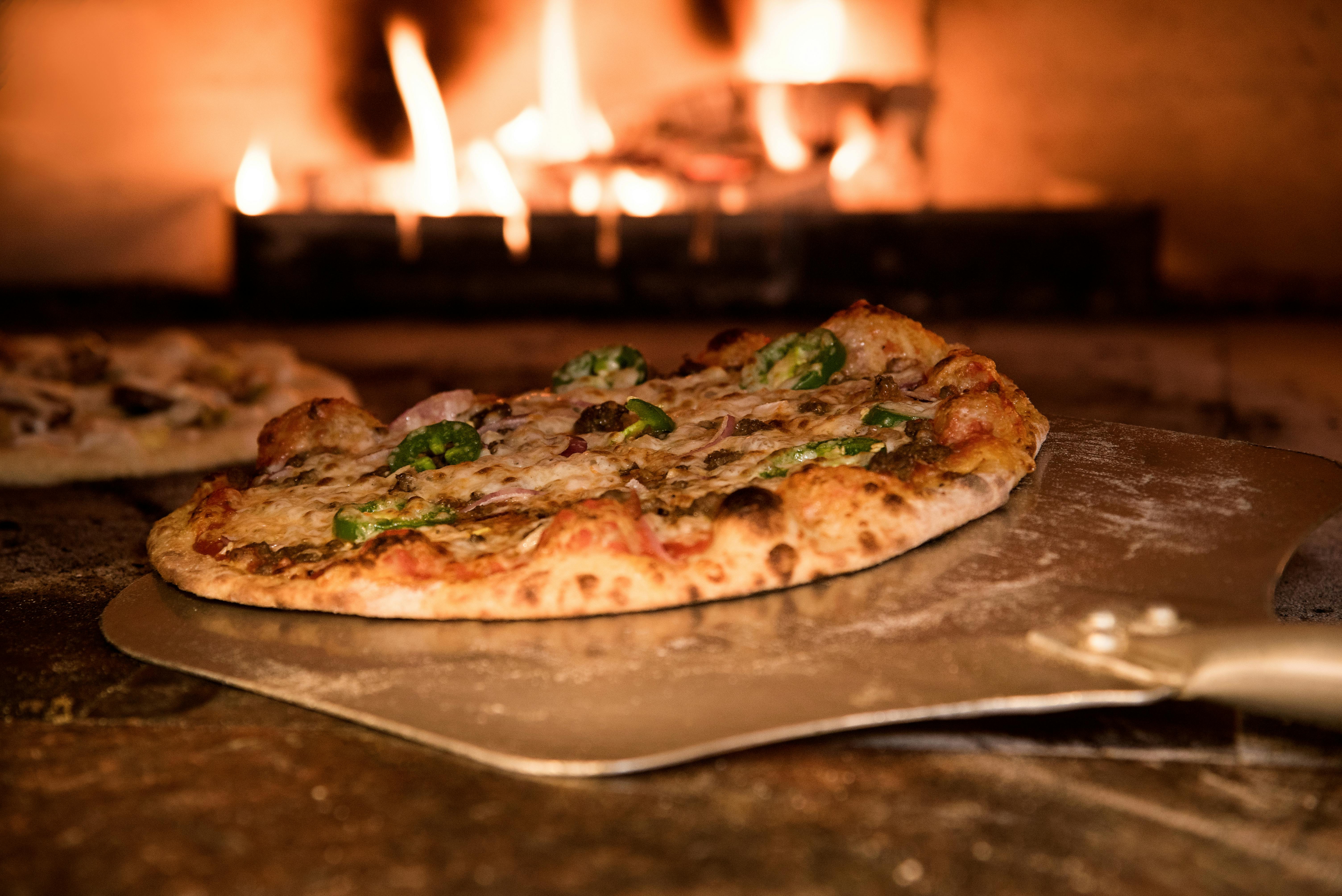 Pizza from a woodfired pizza restaurant powered by SMS Marketing