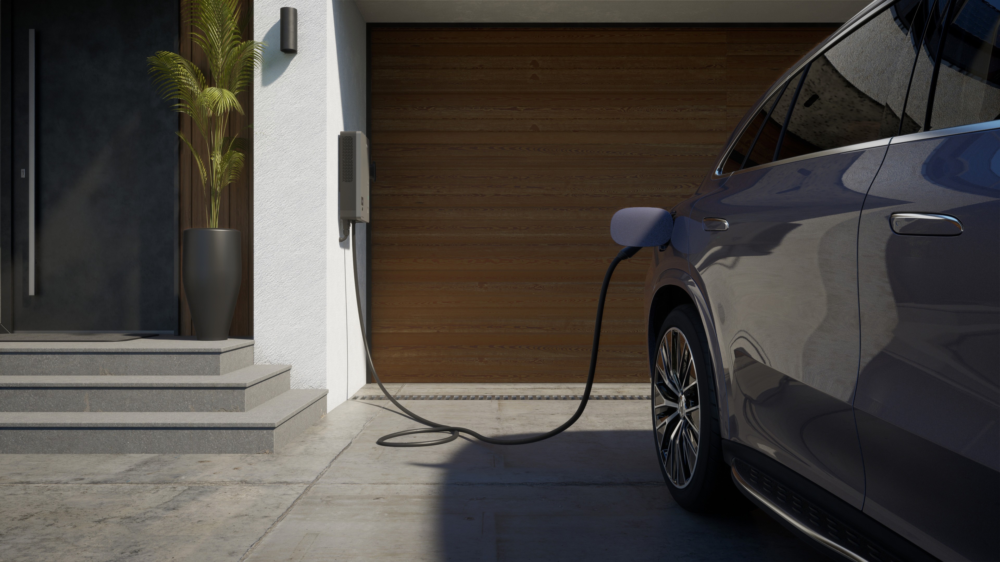 Mercedes-Benz GLC laedt vor der Garage  an der Wallbox