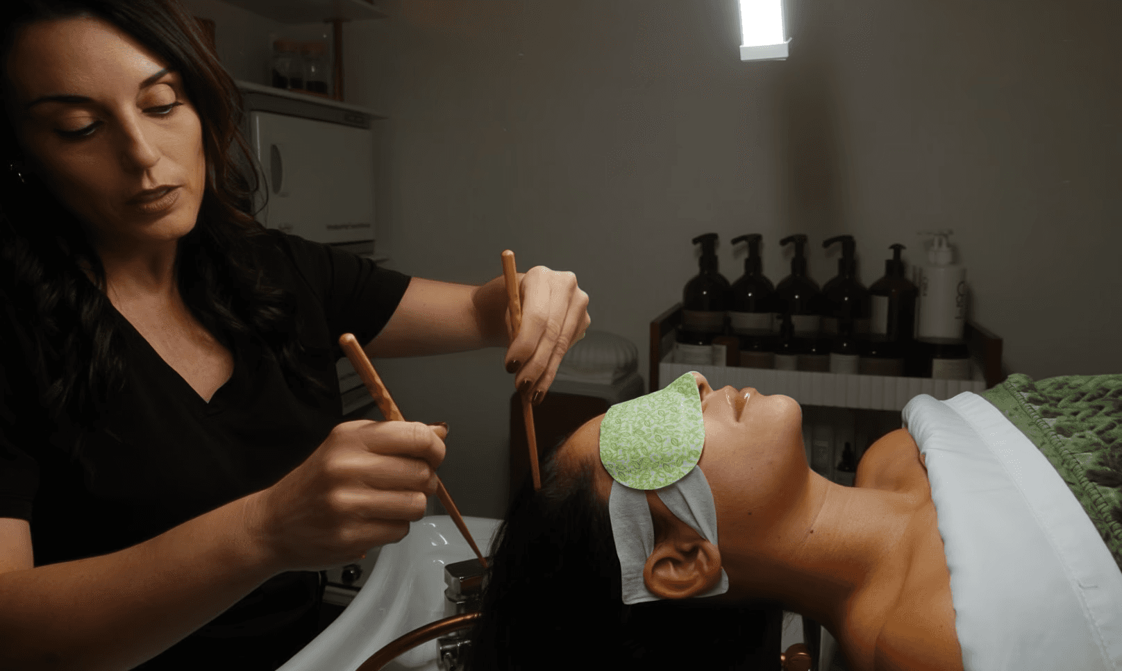 Woman getting a head treatment