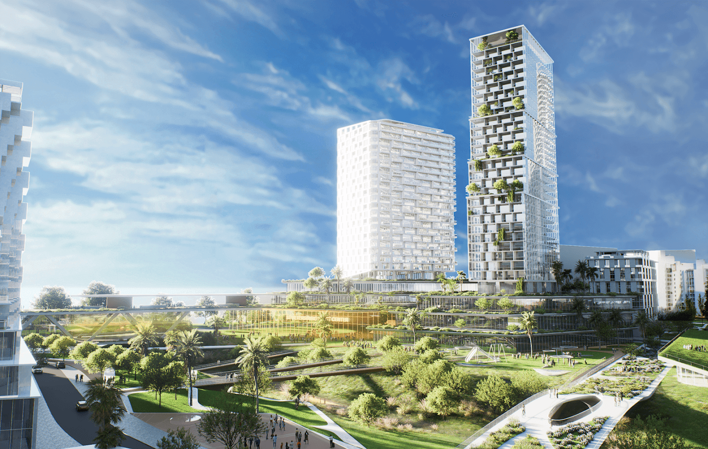 Rendering of two tall green-terraced residential towers at the proposed Historic Gas Plant District redevelopment, surrounded by landscaped grounds, a waterway, and pedestrian paths