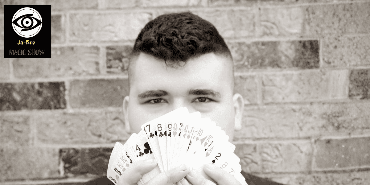 Ja-Fire showcasing his original card tricks, pushing the limits of magic performance.