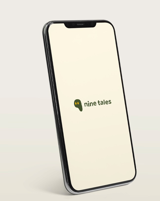 An iPhone mockup image of Nine Tales' (a client work) app loading page with Nine Tales coloured logo in the middle of the screen.