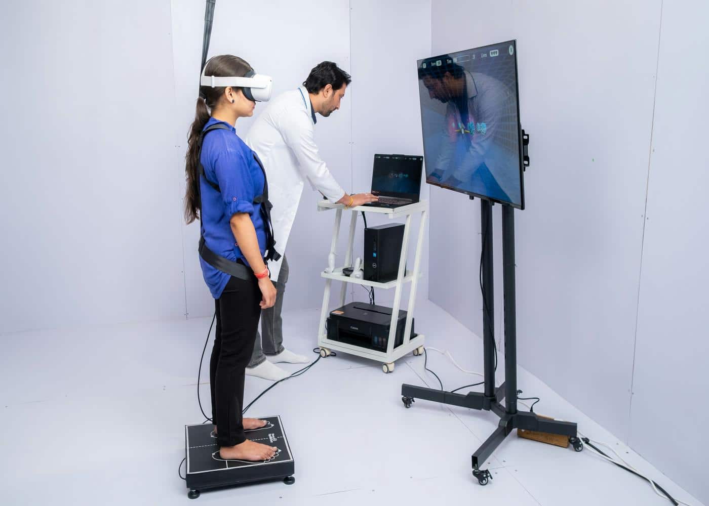 Woman wearing VR headset in front of physician