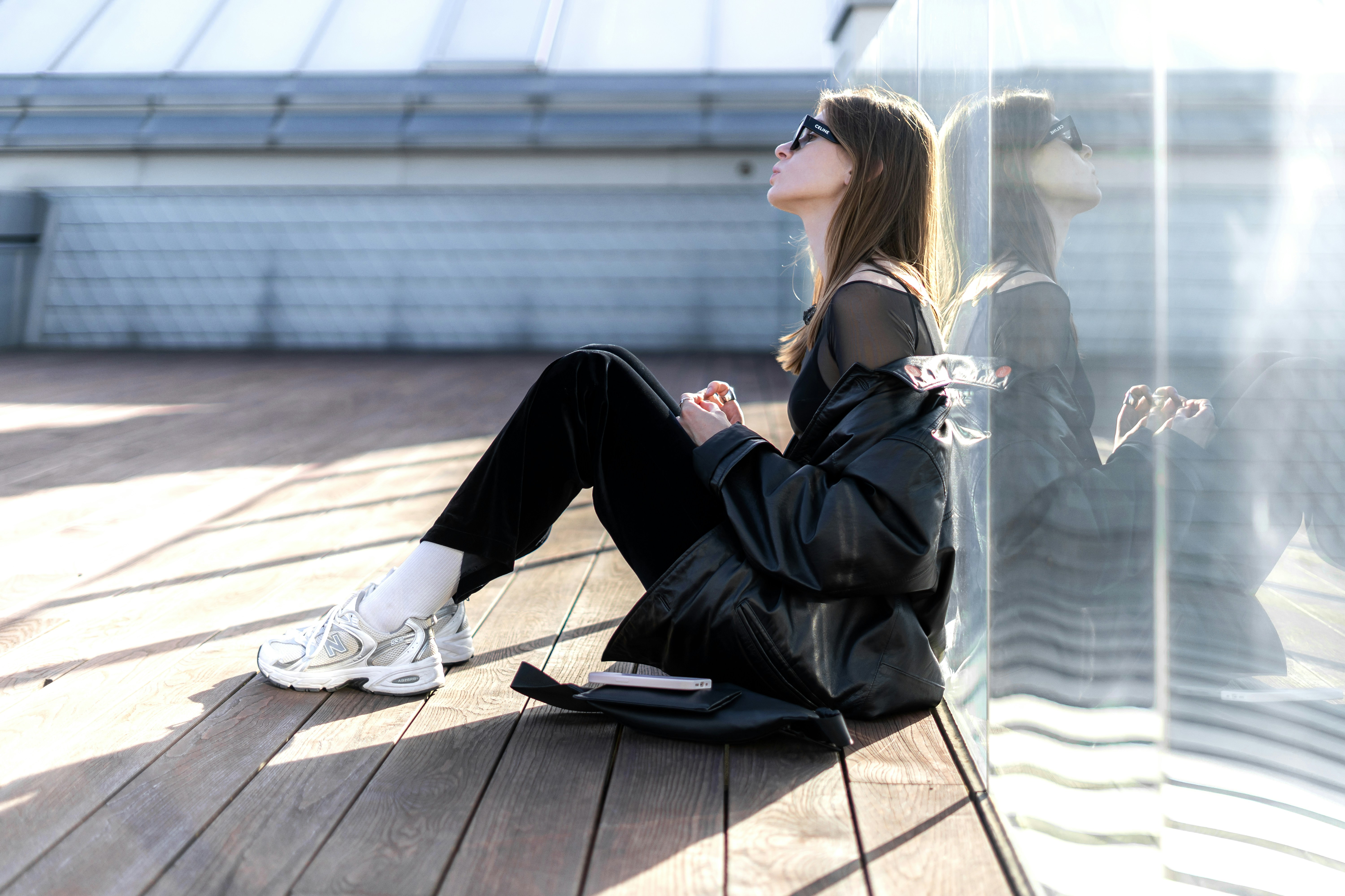 woman leaning on a wall - Preppy