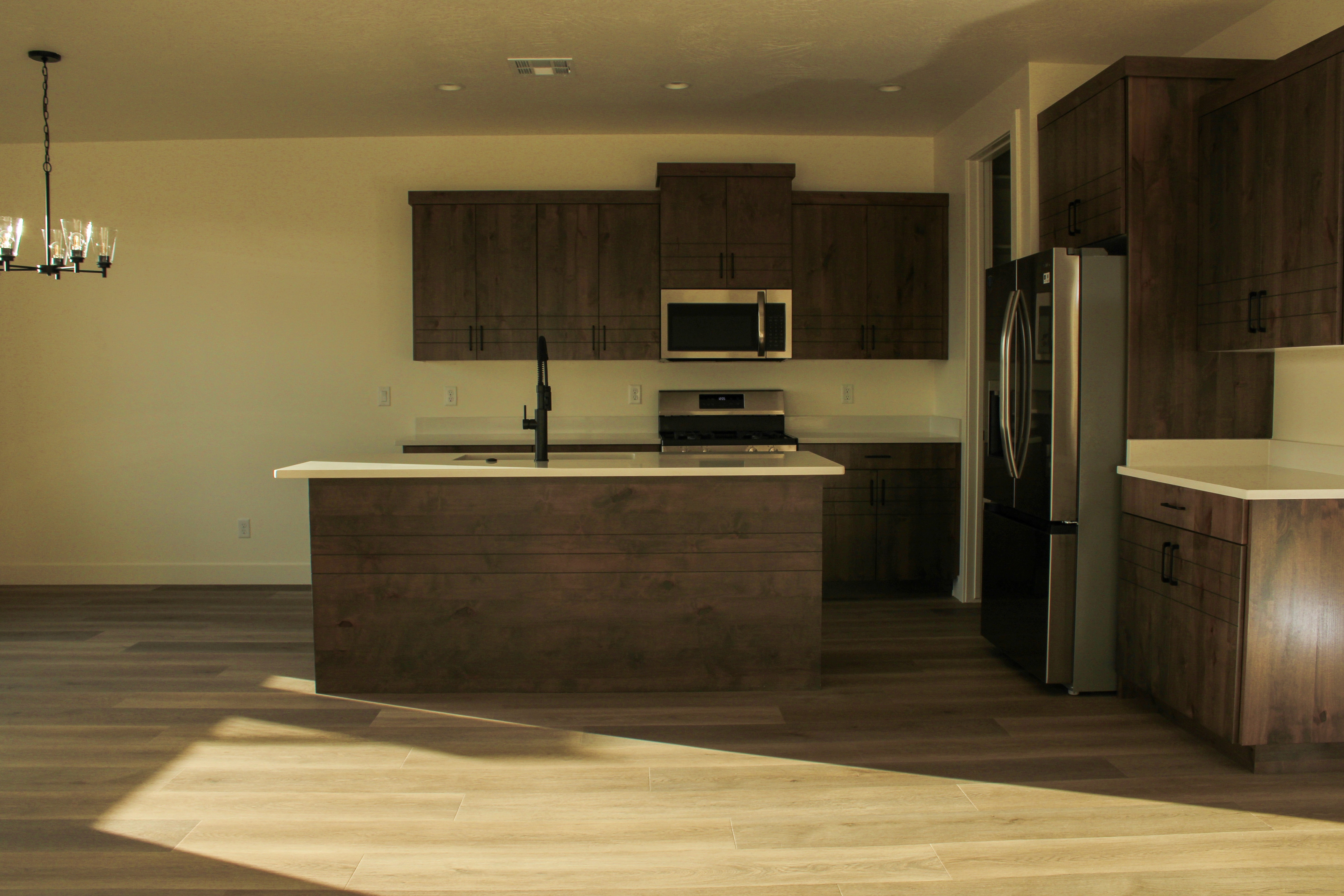 Kitchen view inside the Golden Hour home in Hurricane, Utah showing modern cabinetry and an open layout designed for everyday living.