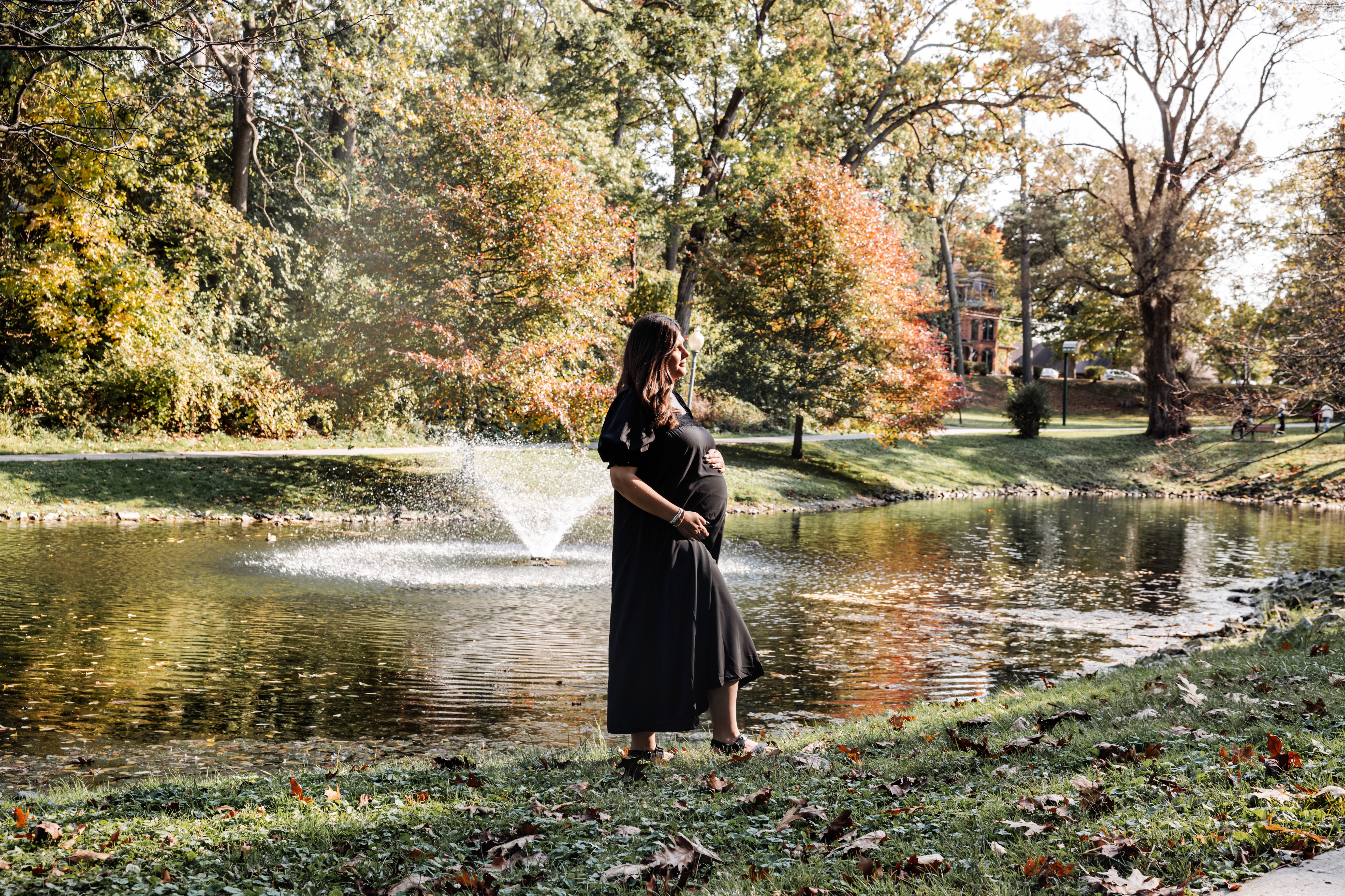 6:13 PMNewly engaged couple sitting on a stoop in the West Village, NYC bathed in warm golden hour light — romantic, candid golden hour engagement photography by Lizz Spano Photography, New York City engagement photographer.