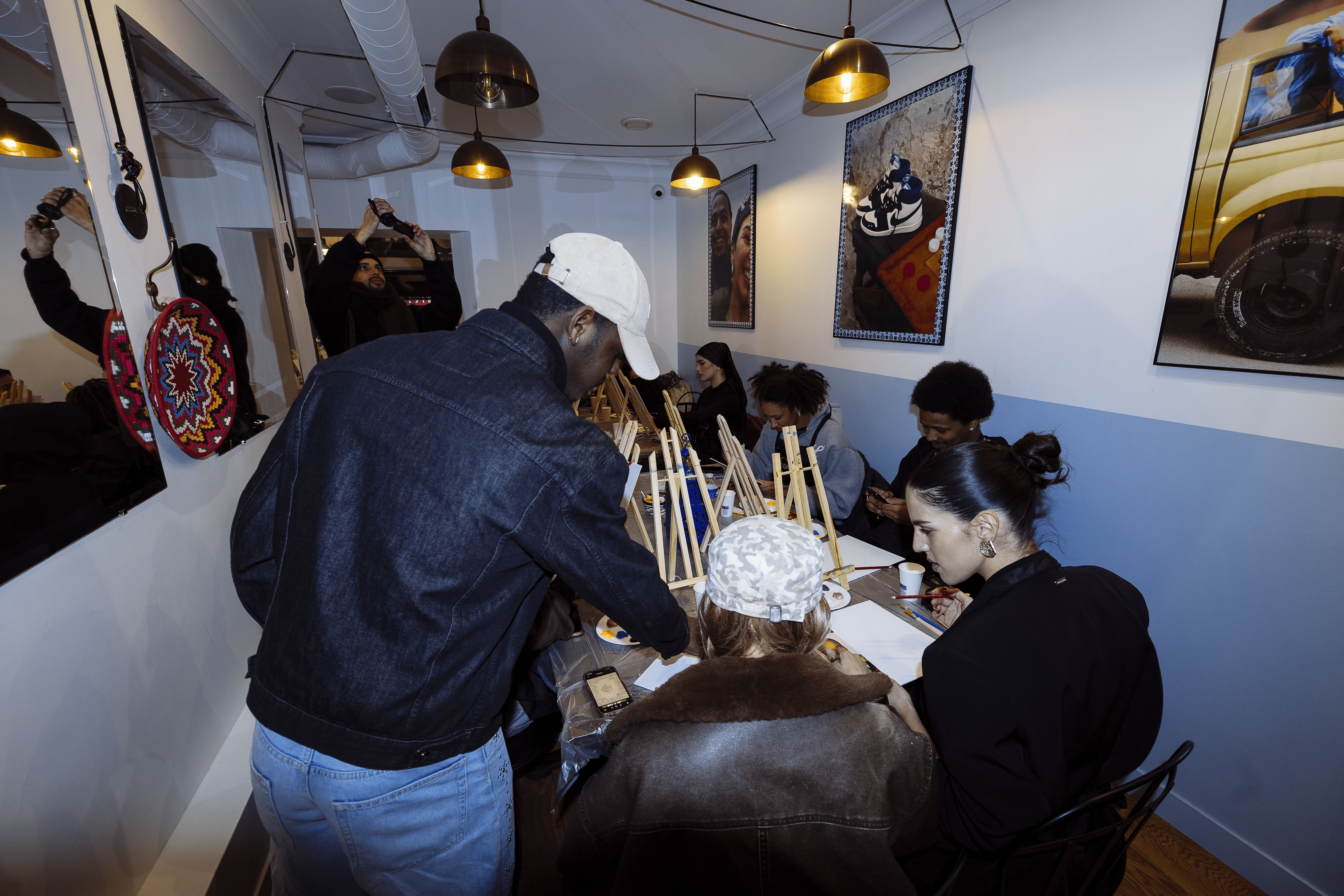 Streetside billboard with flyposters of the Batch.Works brand and illustrations