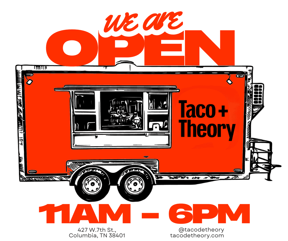 A rustic indoor scene featuring a table set for a meal, including two bowls of rice-based dishes topped with garnishes, an oil bottle, bread, a glass of juice, and milk bottles, all bathed in natural light streaming from a window.