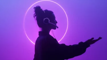 Person wearing a headset in front of a glowing ring