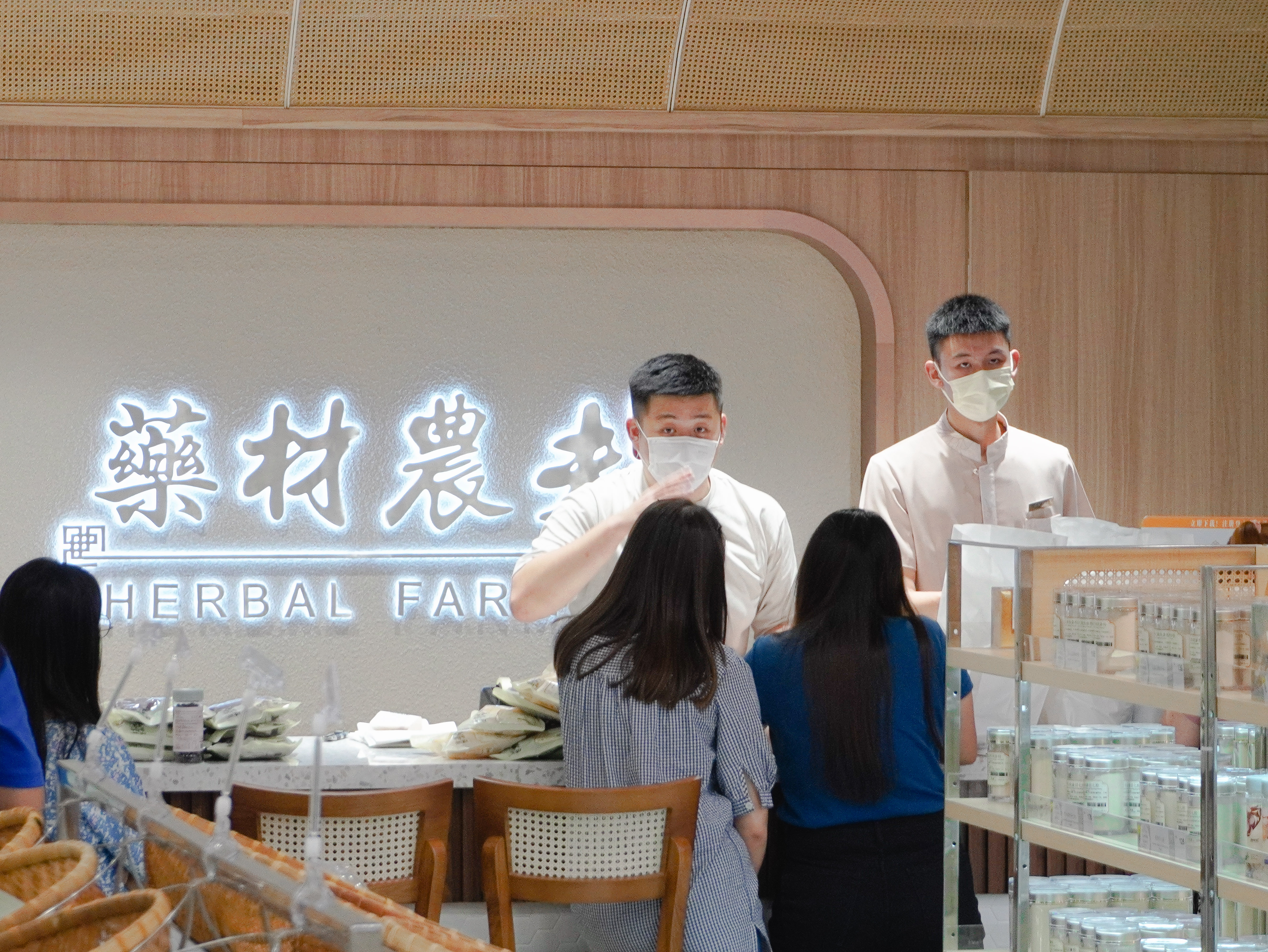 herbal farmer employees serving customers at the retail shop