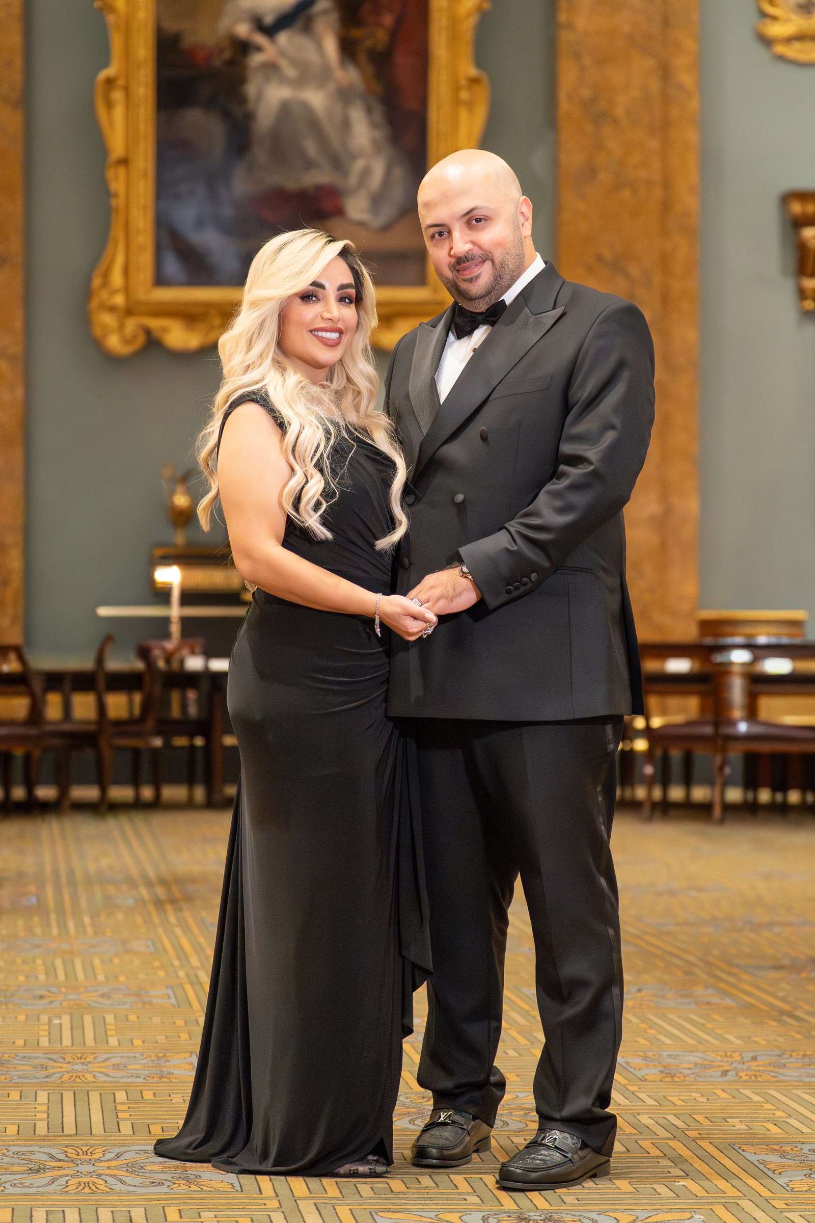 PORTRAITS · A couple photographed at a gala dinner.