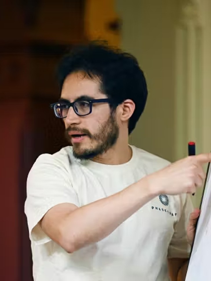 Female scientist in gloves using a microscope beside test tubes, with overlay text about merging biotech, AI, and human-centric research.