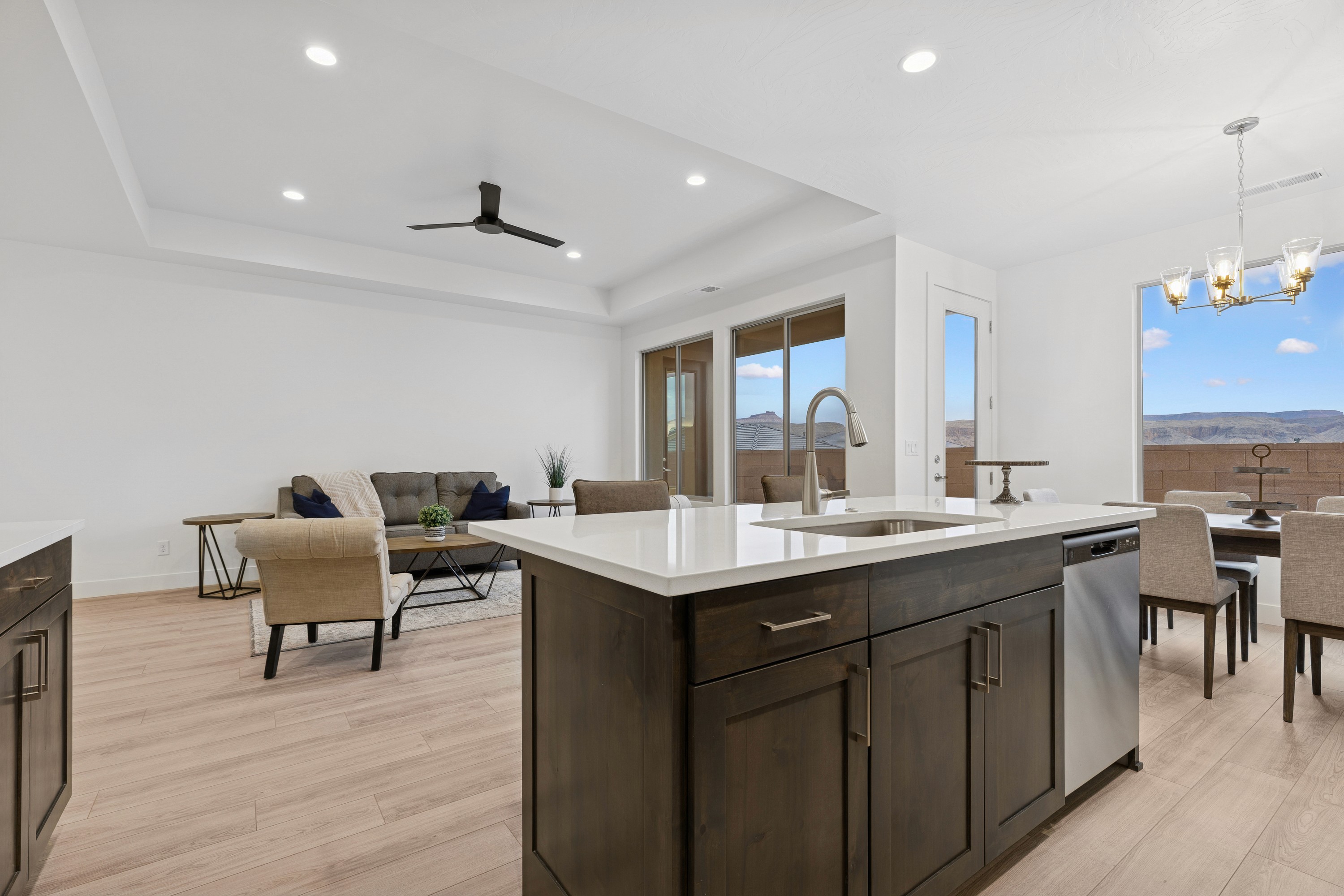 Modern kitchen in The High Desert Home with dark cabinetry and open layout in Hurricane Utah.