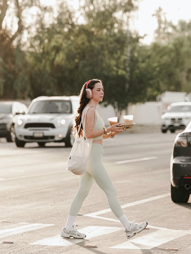 a laptop computer sitting on top of a white chair