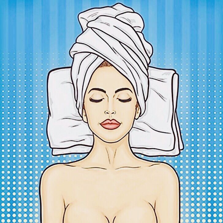 A woman smiling at the camera in a cafe