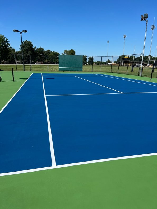 Freshly resurfaced court showing bright colors and smooth surface