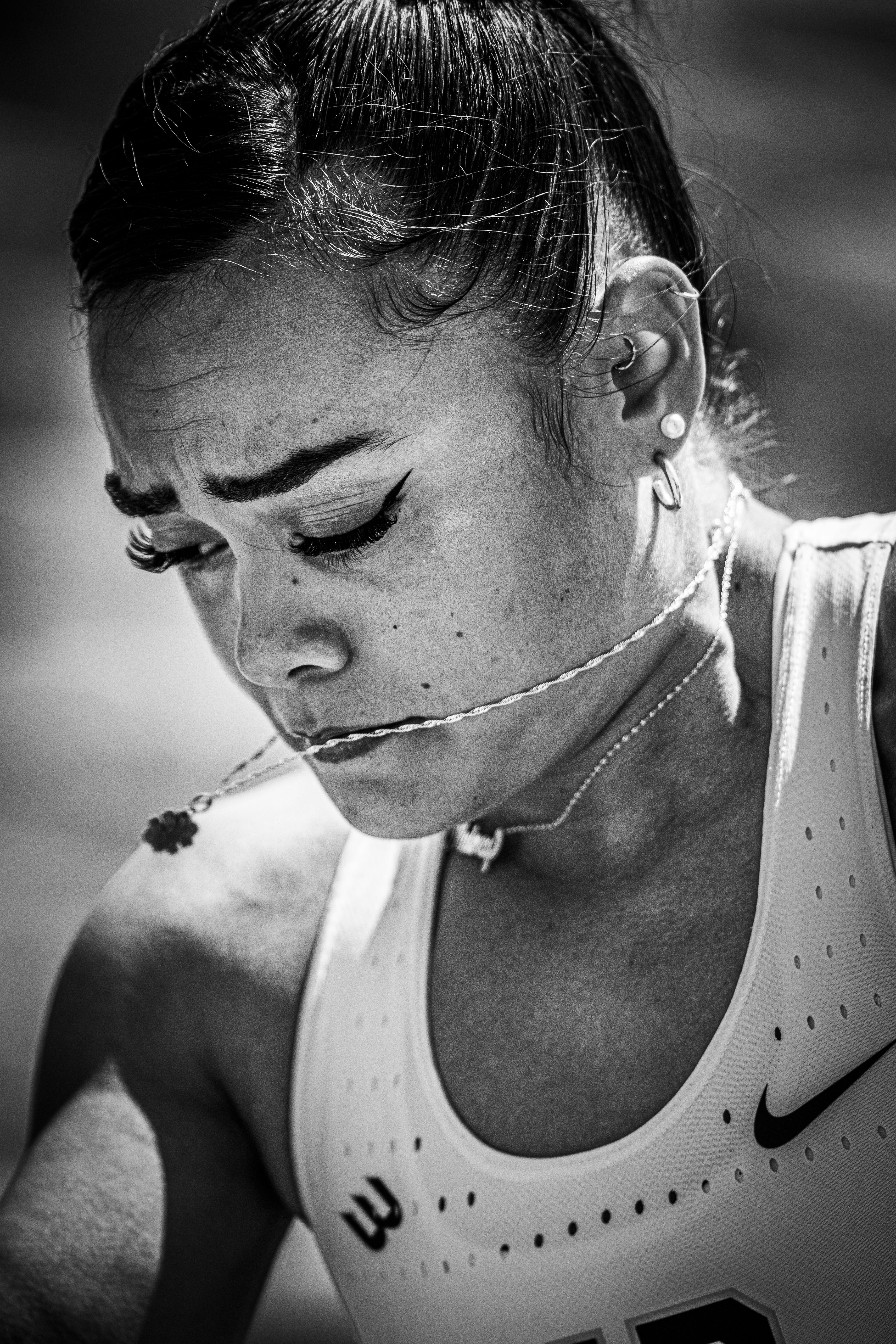 Athlete with necklace and focused expression