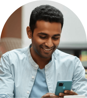 African man smiling on phone