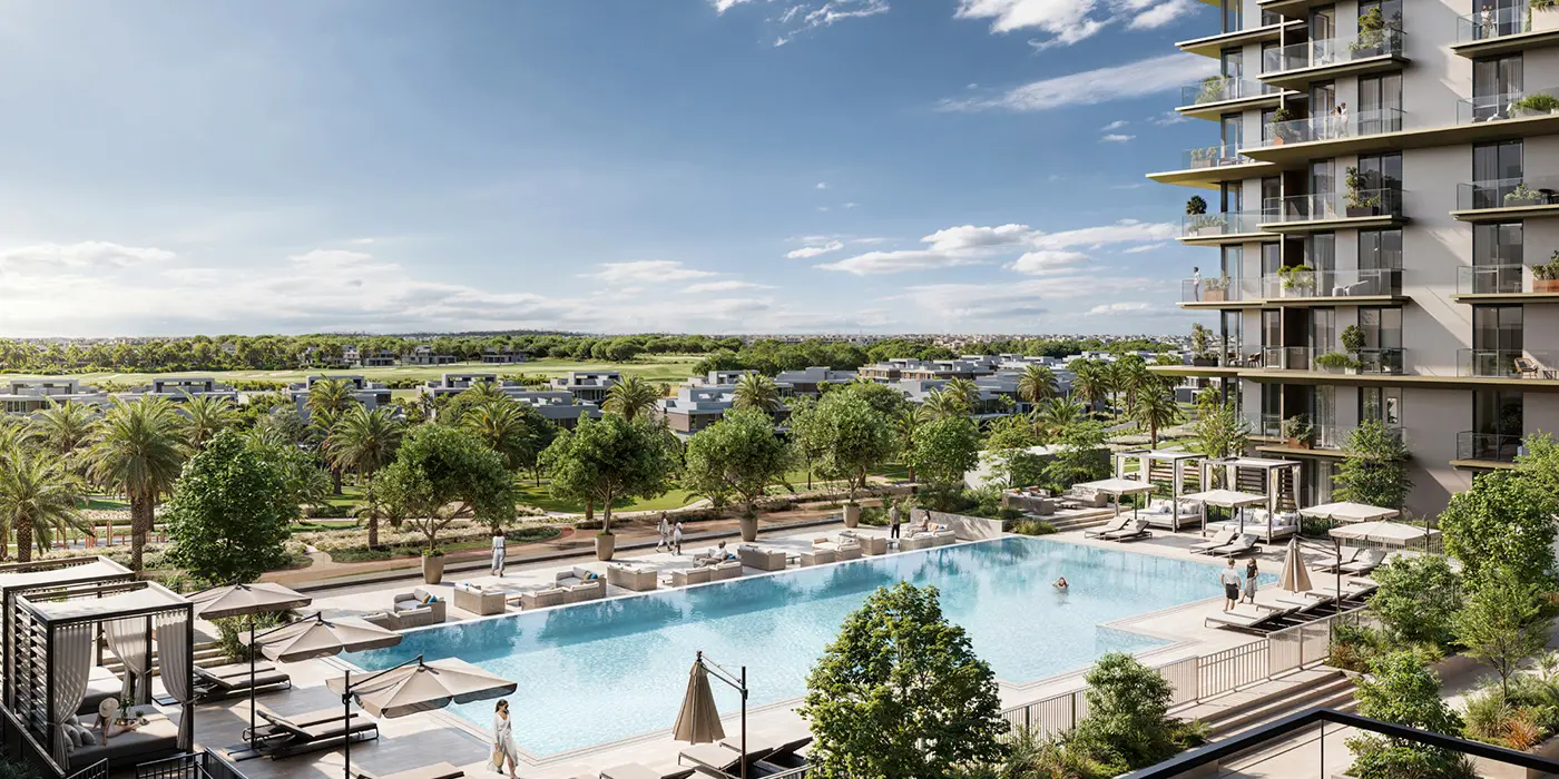 Luxury poolside at Dubai Hills Estate with lounge chairs, greenery, and modern buildings in a serene resort-style setting.