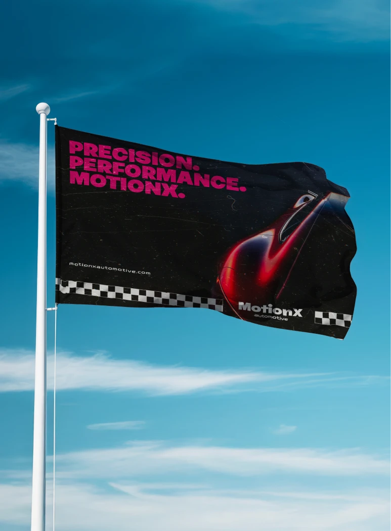 MotionX brand website shown on a laptop resting on a pink sports car