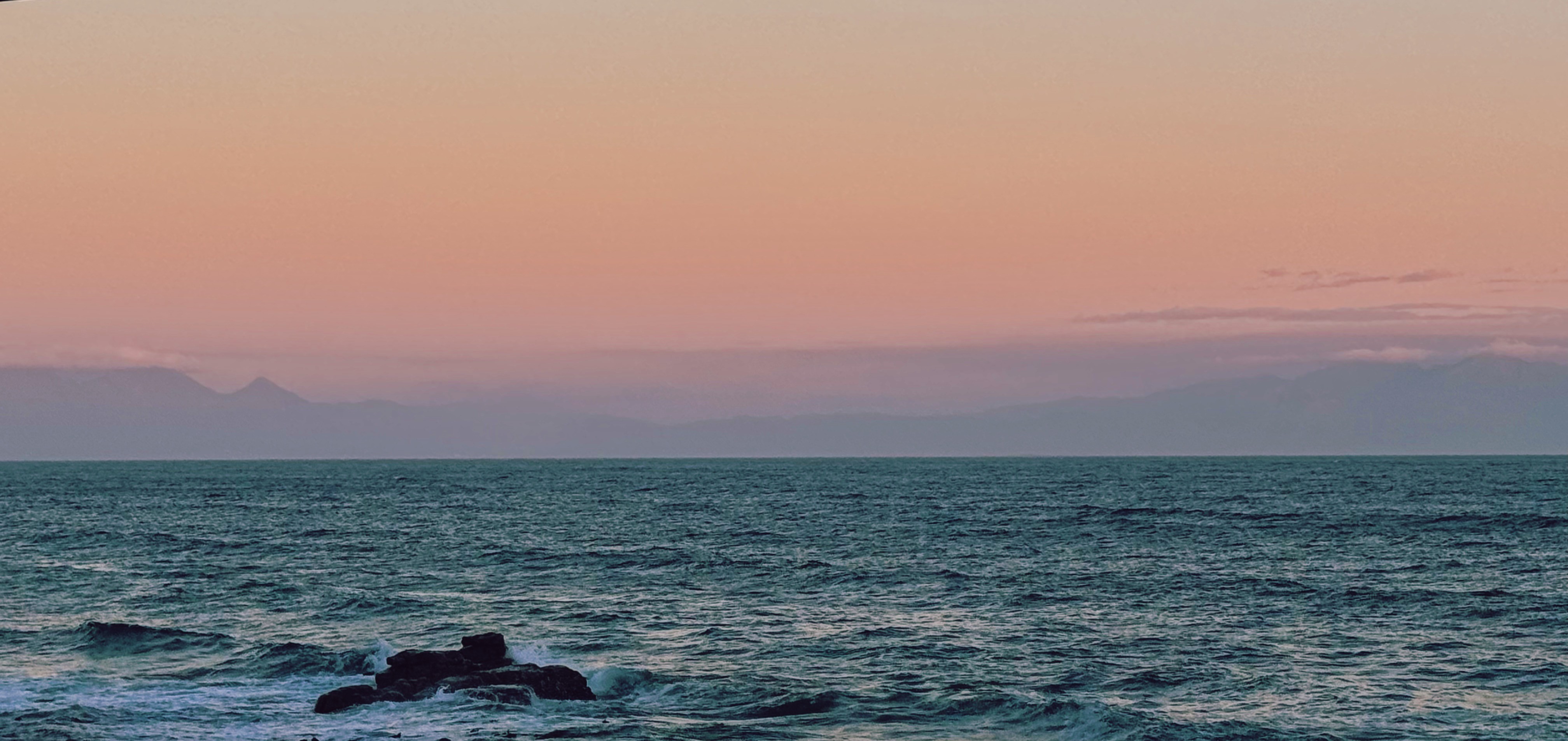 Beautiful sunset above the ocean in Muizenberg, Cape Town