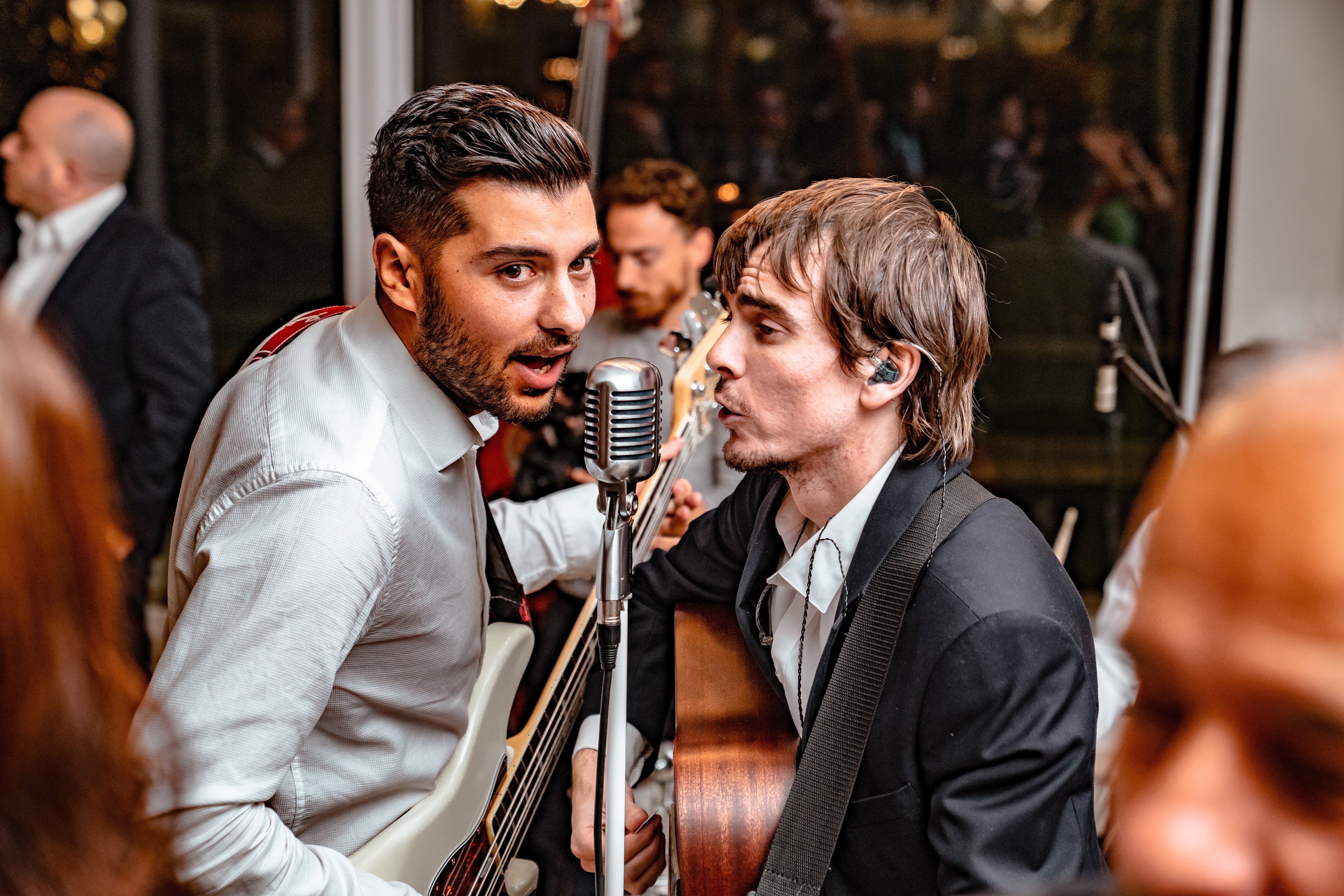 Two men singing in an event - different voice types