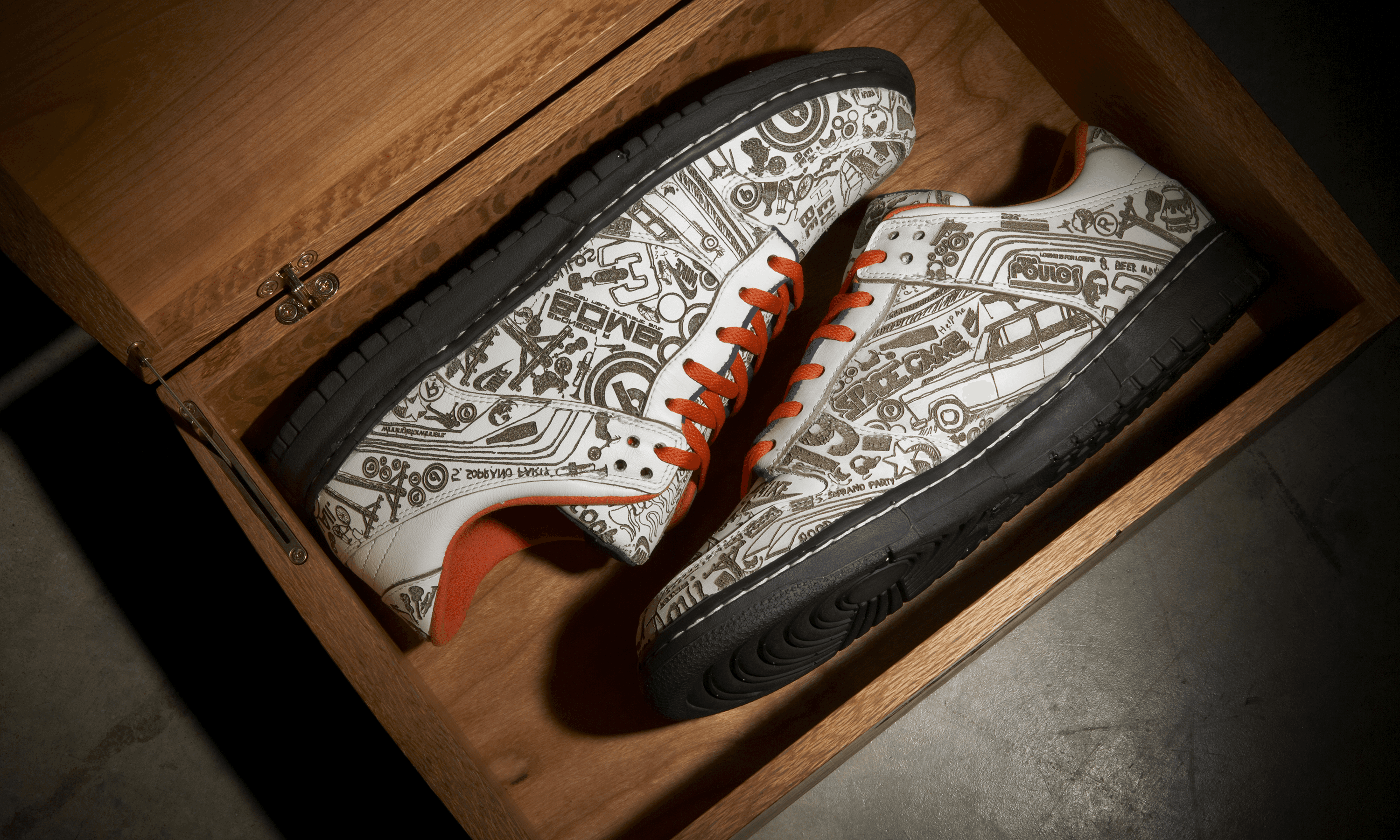 custom lasered nike dunk shoes inside a custom, lasered wooden shoe box