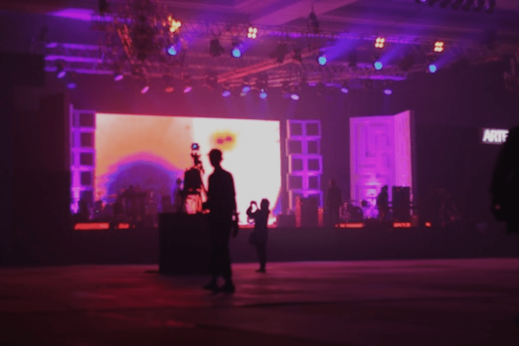 Stage lights, crowd silhouettes