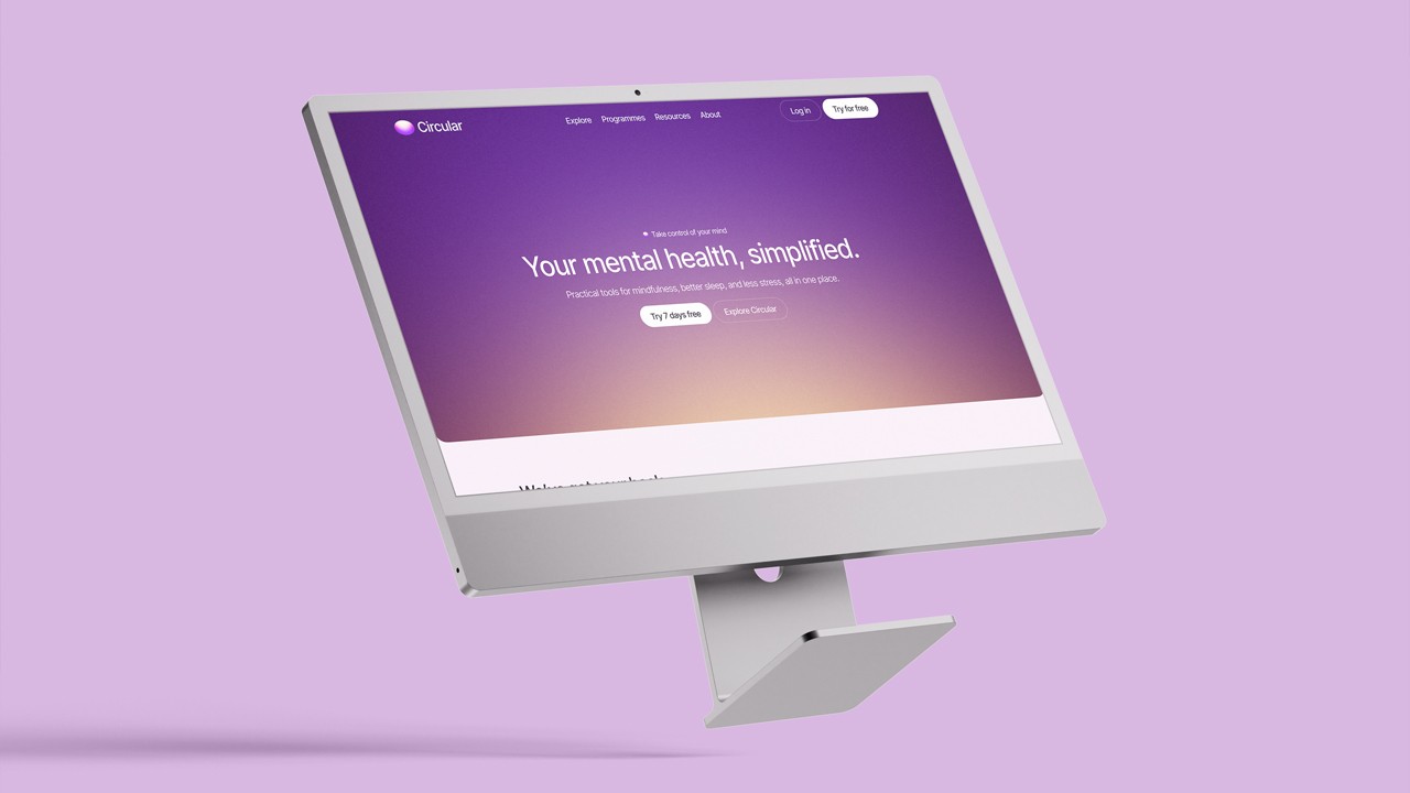 Silver desktop monitor tilted against a solid lilac background, displaying the Circular website homepage with a purple gradient hero section, the tagline “Your mental health, simplified.” and call-to-action buttons.
