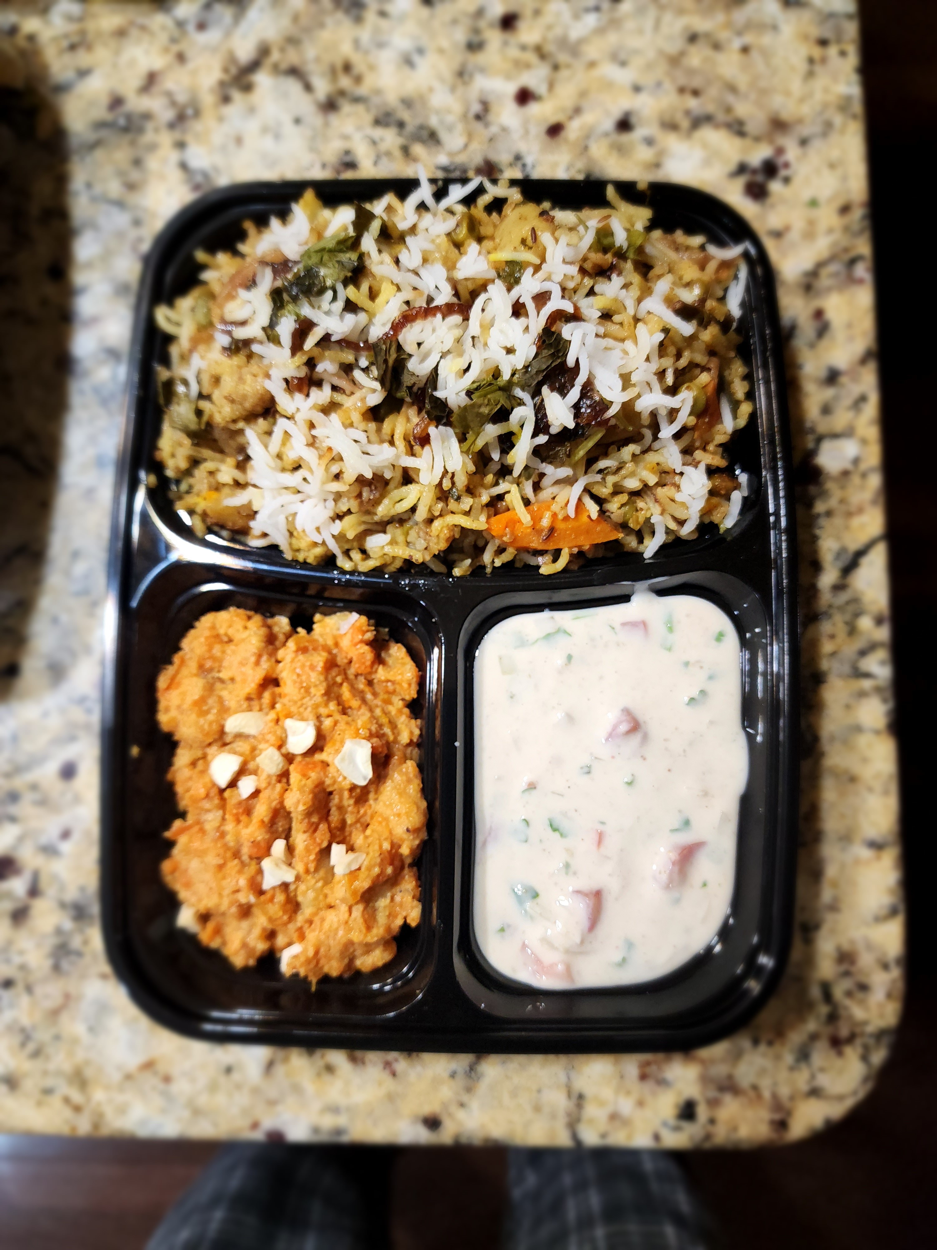 An image of a rice bowl in a tiffin