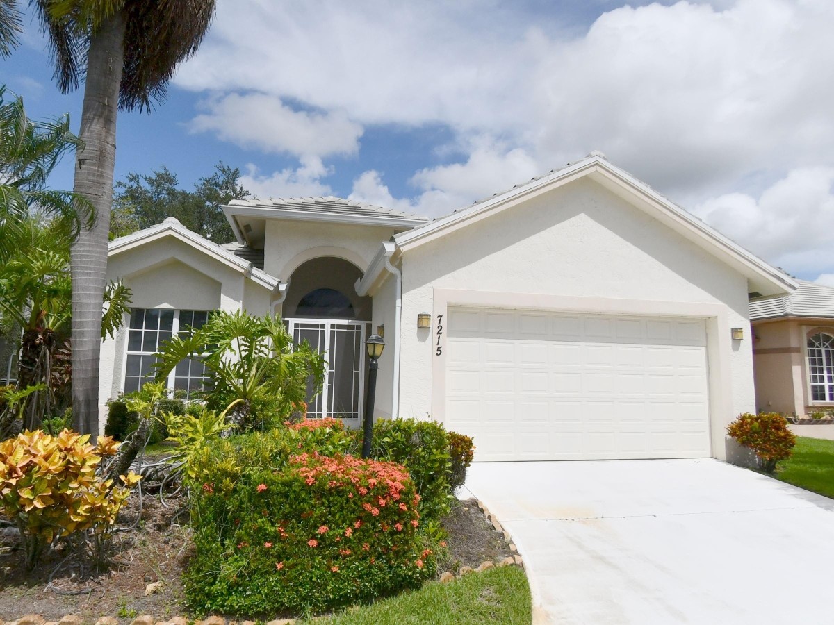 1995 New Roof Construction in Marsh Landing, PGA Village, Port St Lucie with Entegra Flat Broomswept Tile in Natural Gray