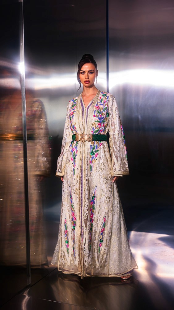 Ivory Moroccan caftan with colorful floral embroidery, handcrafted luxury piece for elegant events in Bahrain