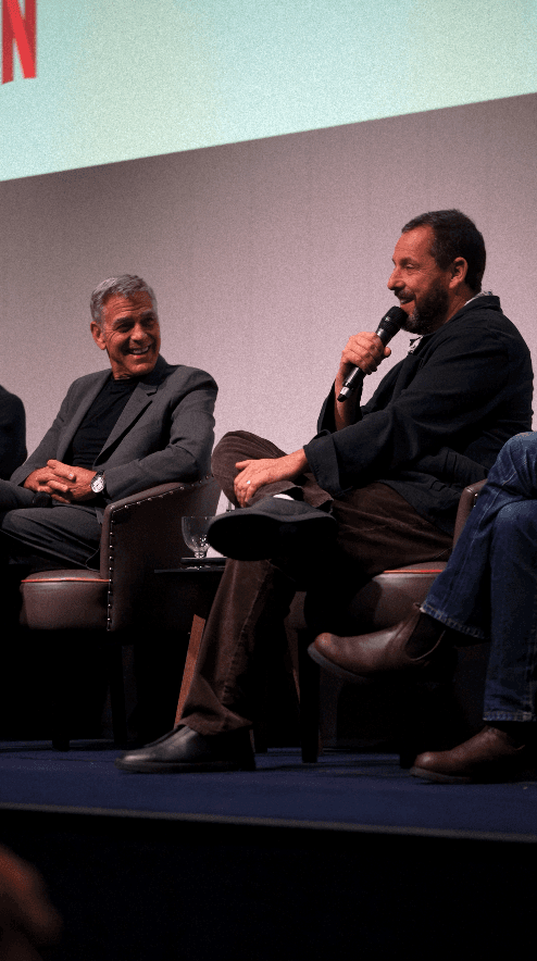 Close-up of bride and groom's torsos, bride in white dress
