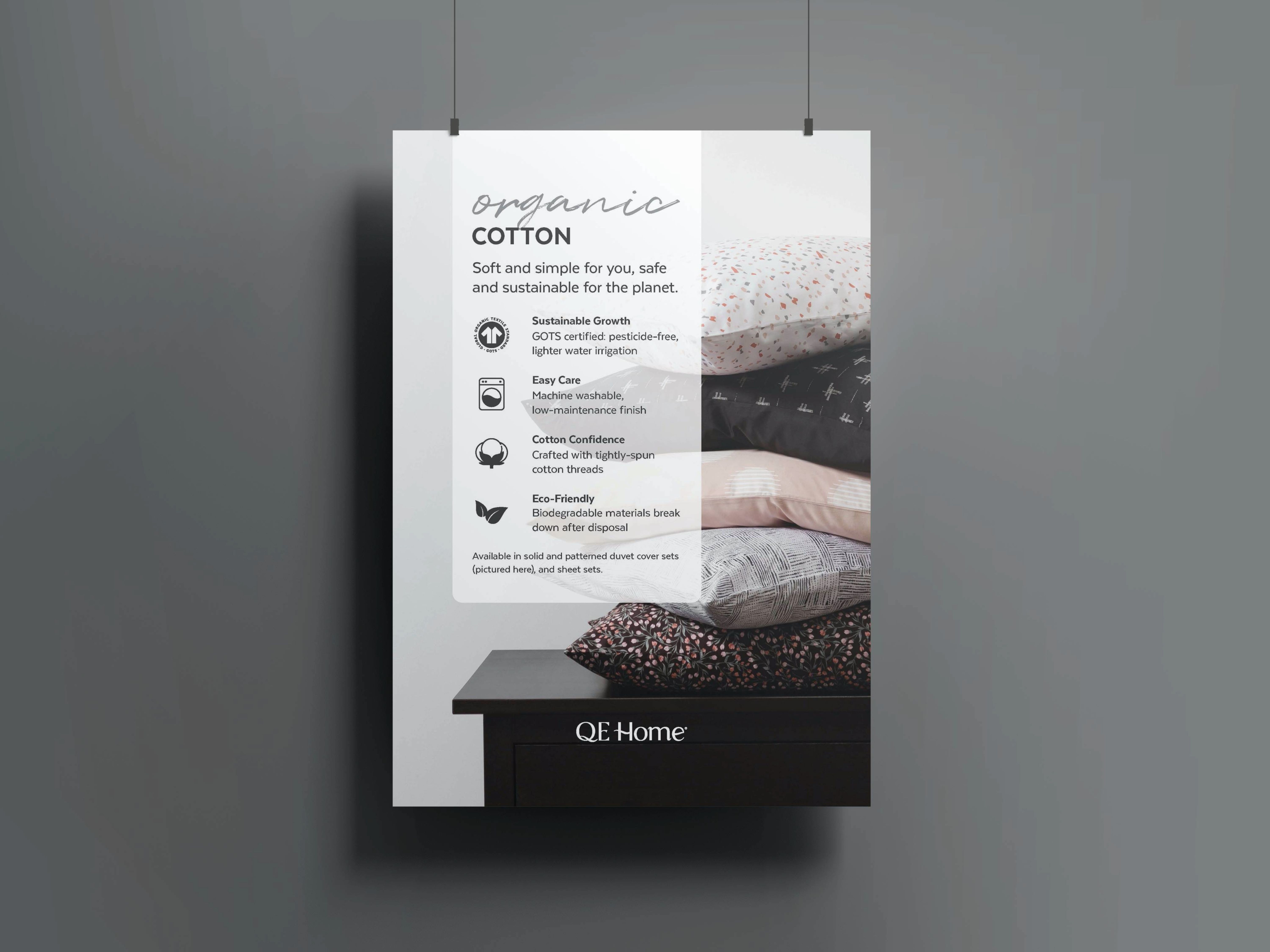 QE Home in-store poster highlighting Organic Cotton product benefits including sustainable growth, breathability, and eco-friendly properties