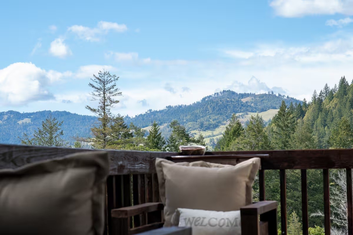 The private studio deck at Dark Fairy Farm overlooking the surrounding mountains.