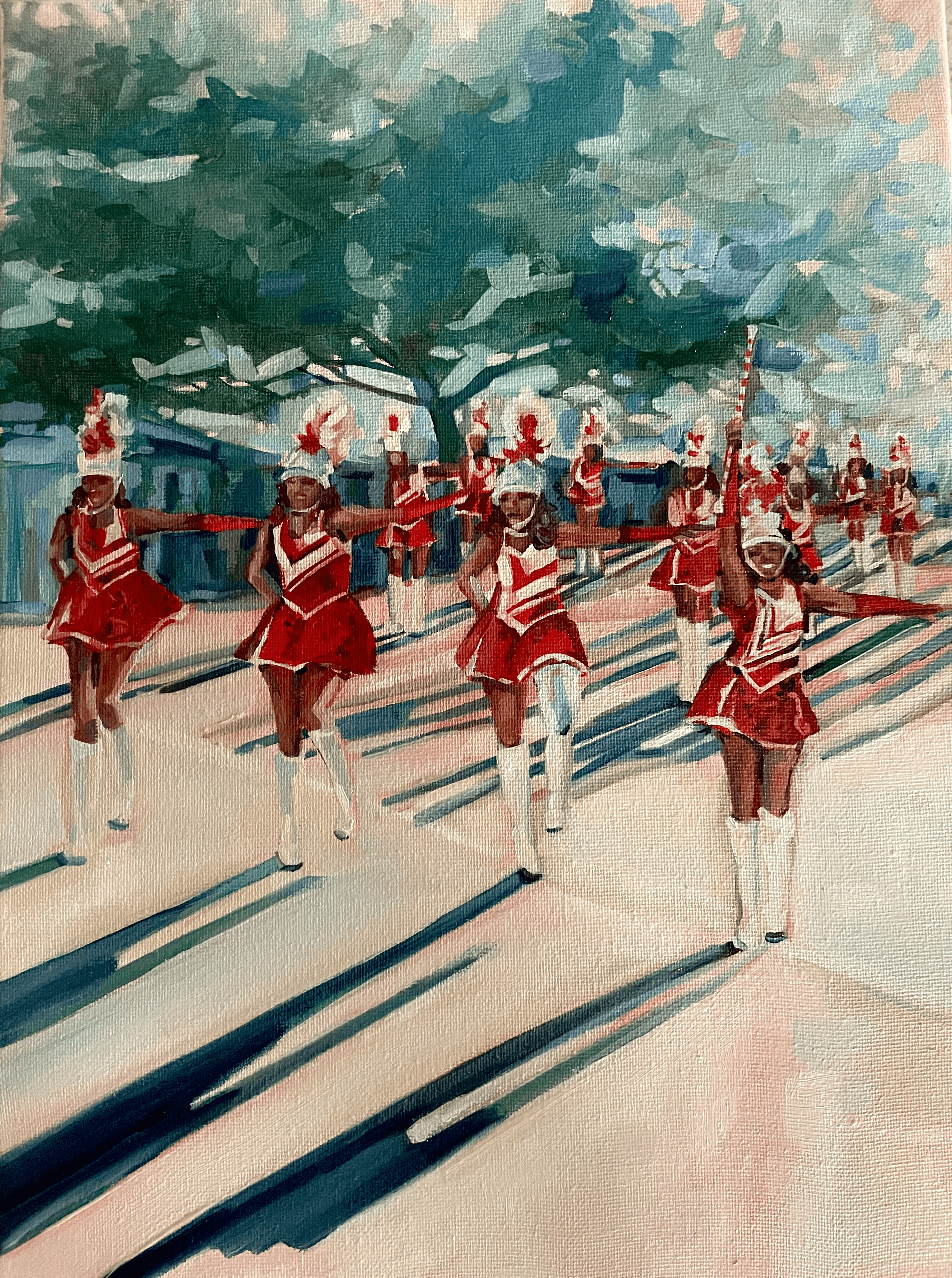 An impressionistic oil painting on a 12x16 canvas depicting a line of Black majorettes marching in a Bermuda Day parade. They wear vibrant red and white uniforms, white boots, and tall feathered hats, casting long, dramatic shadows on the ground under a lush green tree canopy.