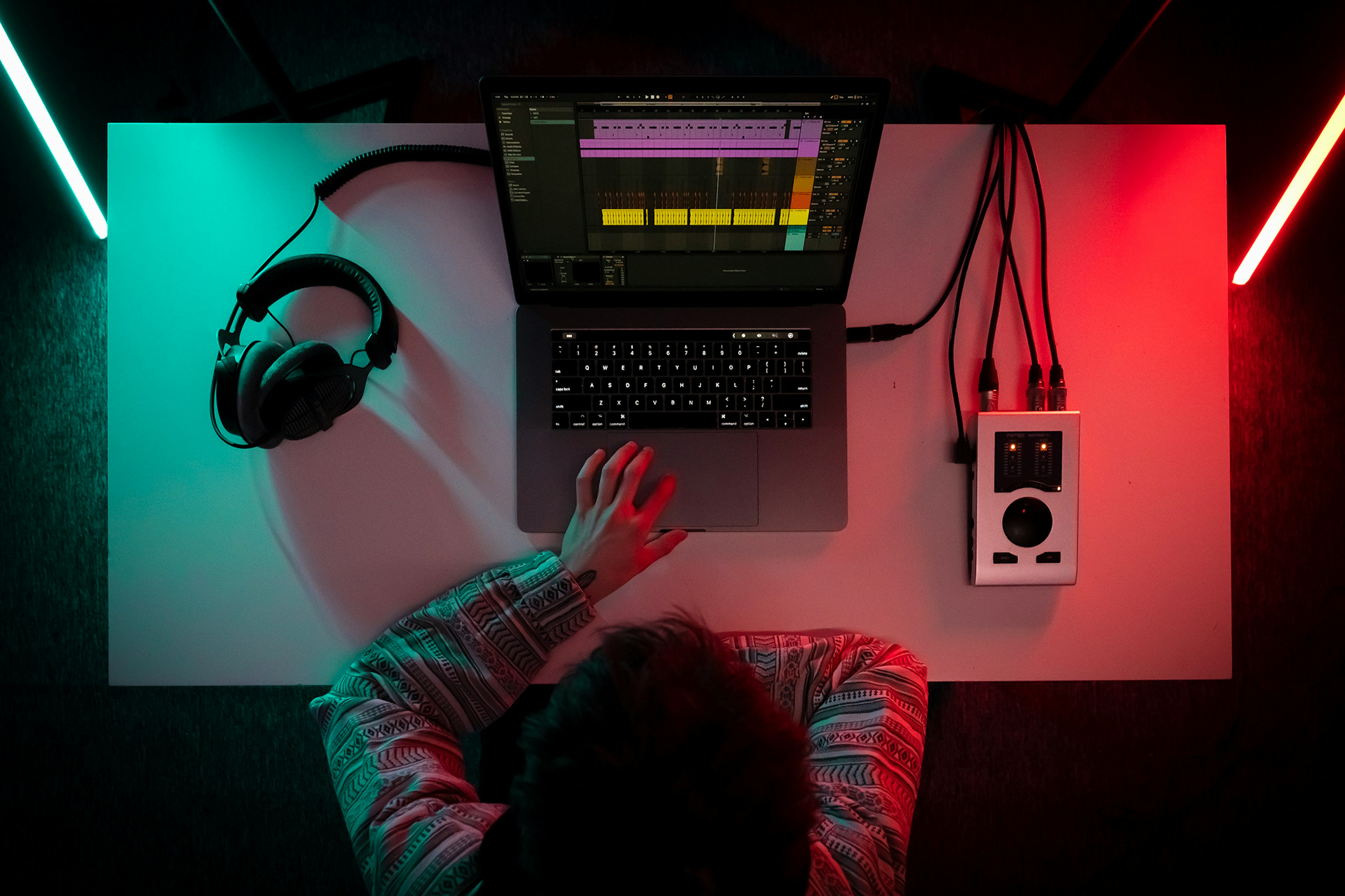 man creating music on laptop - Music production programs