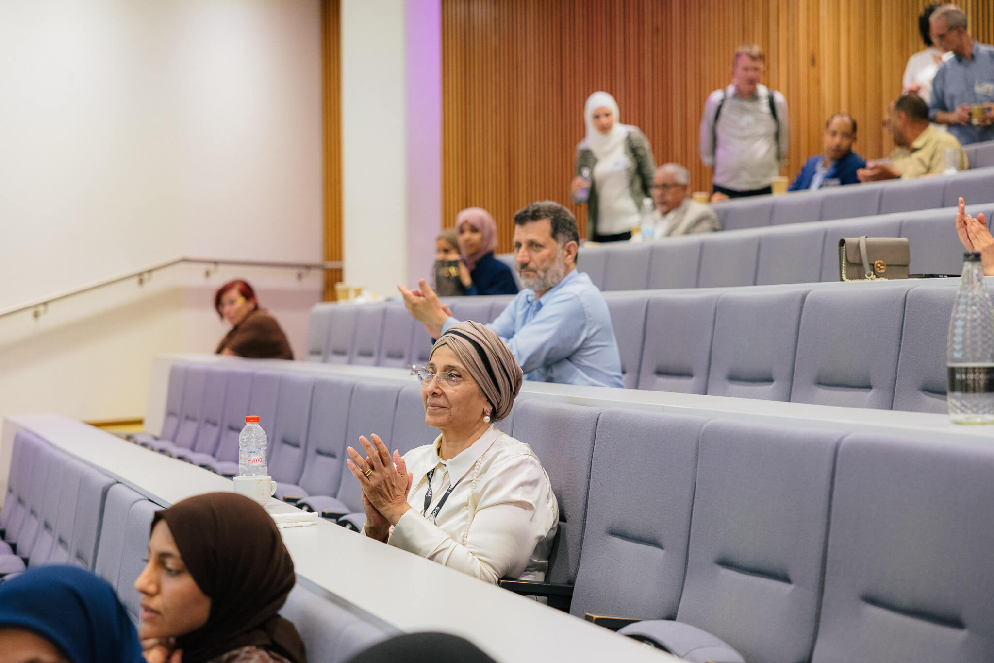 Audience applauding during a professional workshop, candid event photography London