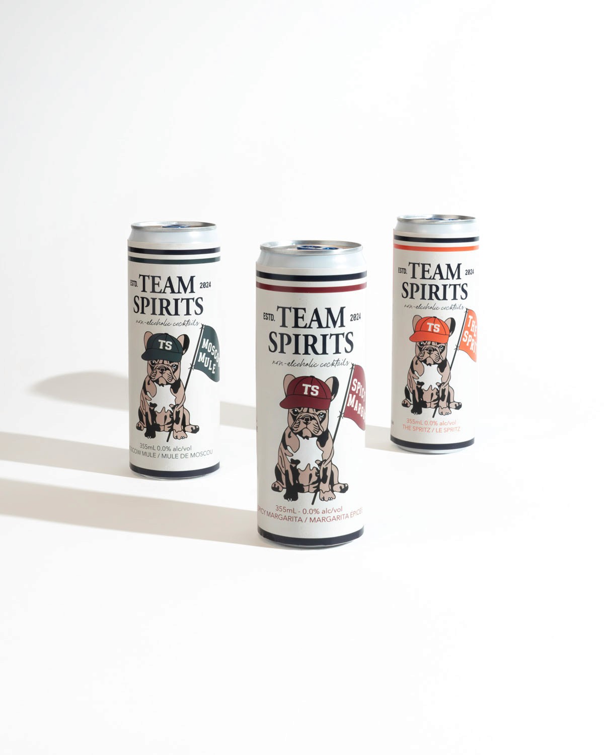 Product shot of ‘Team Spirits’ canned beverages captured at Node Studio, featuring a clean, minimalist white background that highlights the unique branding and design of the cans