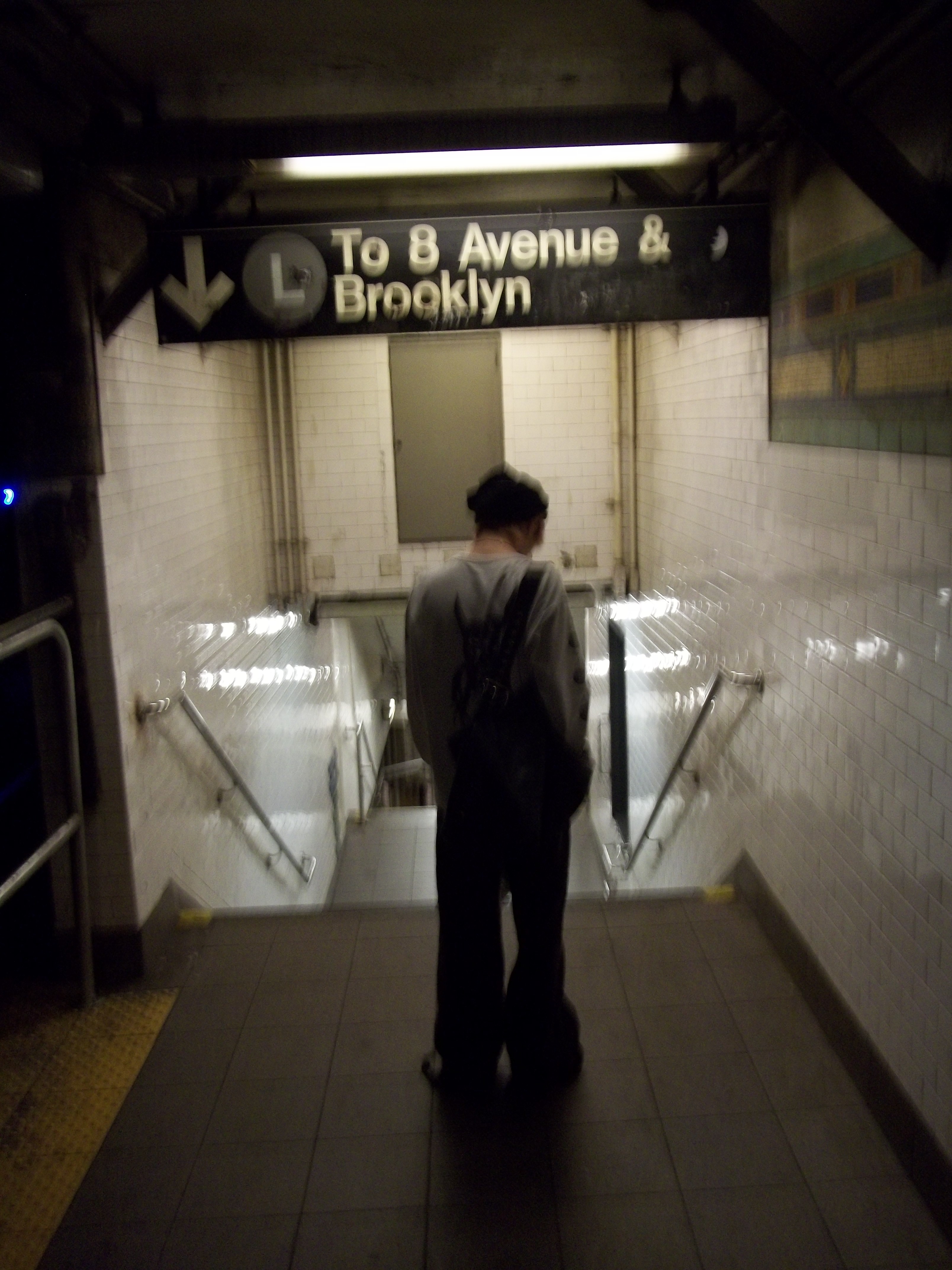a blurry photo of a person standing in front of a wall