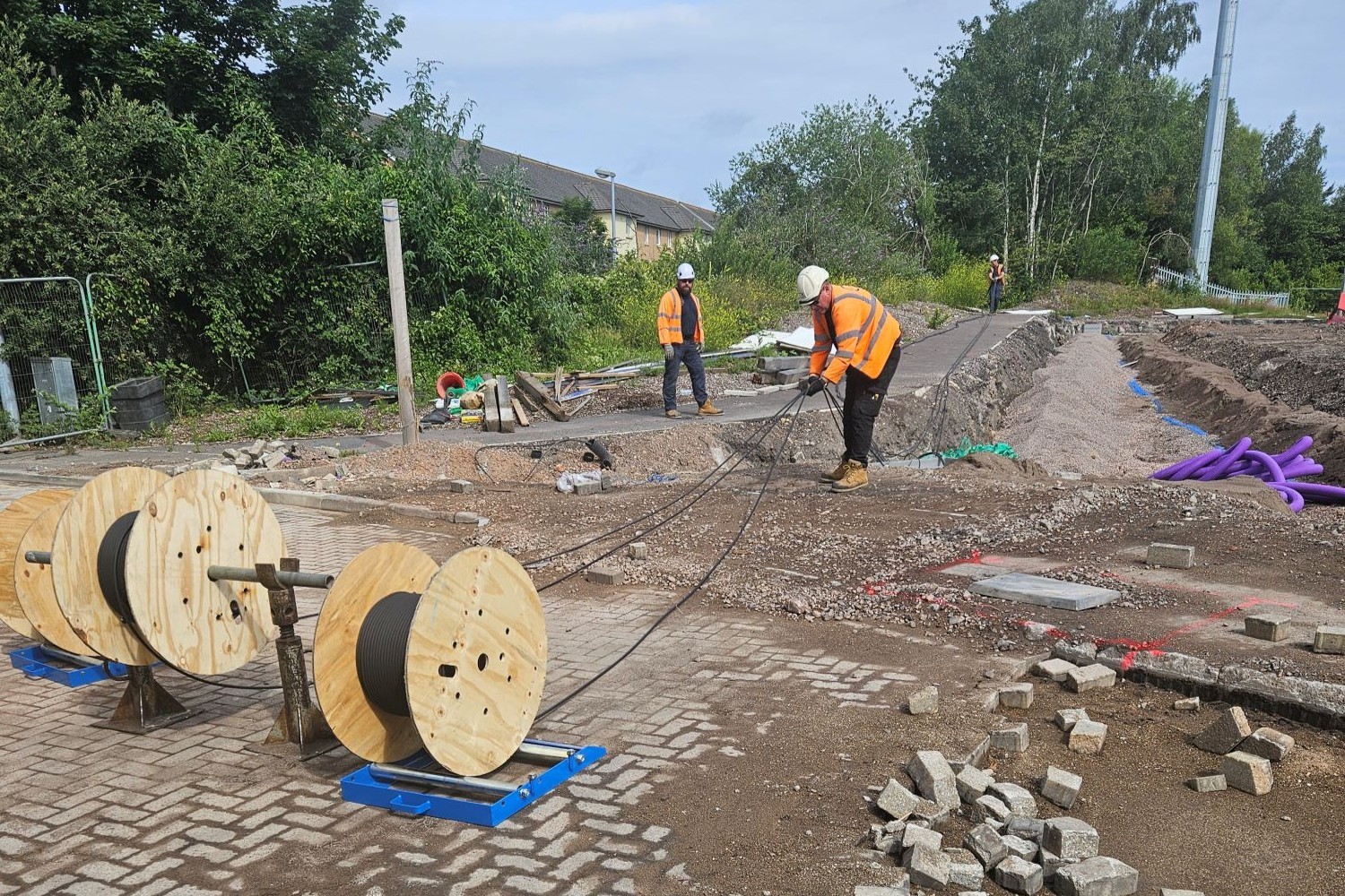 CK Workers Pulling Cable
